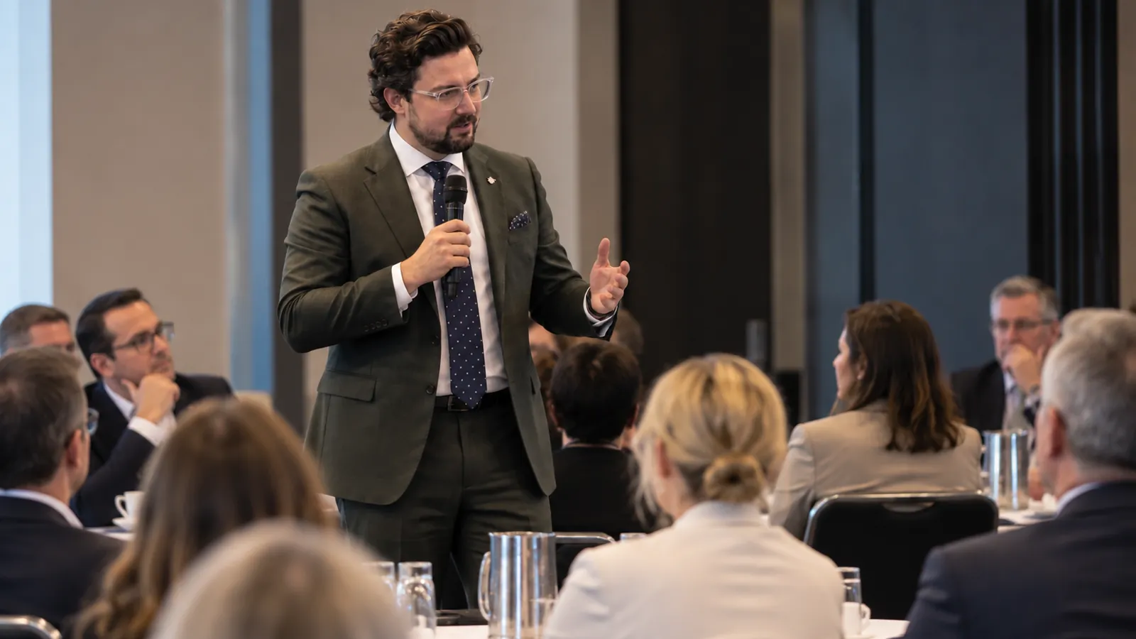 Joshua Baldwin addressing delegates at an industry conference